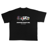 THE KIT STEALER TEE, front: black heavyweight cotton tee with a cartoon of a thief running off with a stack of shirts from a smashed car, above EVERYONE WANTS ONE.