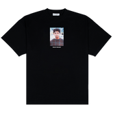Funchal Tee, front: black heavyweight cotton tee printed with a photo of a young Cristiano Ronaldo behind a goal net, THE KIT DEALER wordmark below
