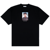 Funchal Tee, front: black heavyweight cotton tee printed with a photo of a young Cristiano Ronaldo behind a goal net, THE KIT DEALER wordmark below